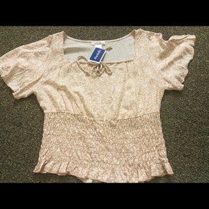 Pinkish short sleeves shirt it’s a blouse